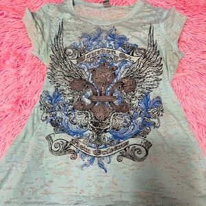 Light blue top, size medium 8/10, designs front and back.